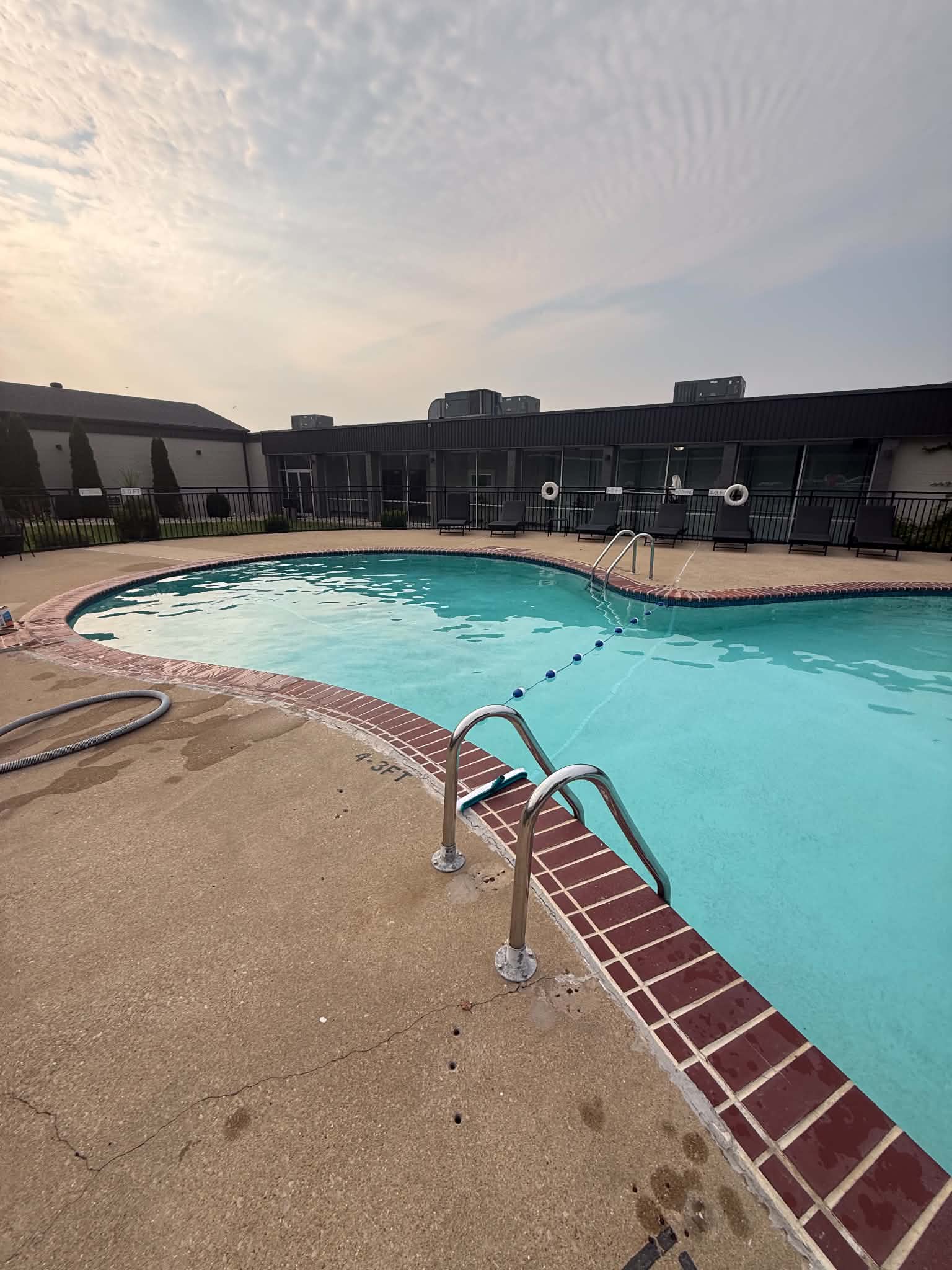 The outdoor hotel pool with blue water after service